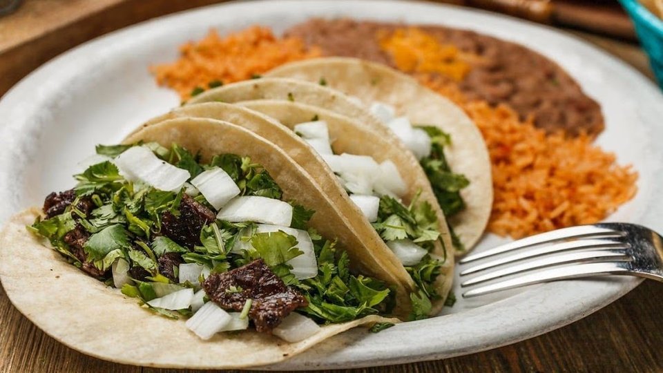 Menu page listing burritos and chimichangas.