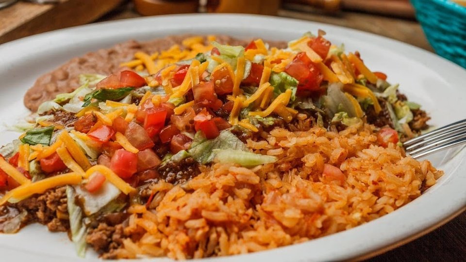 Appetizers and entrées arranged on a menu.